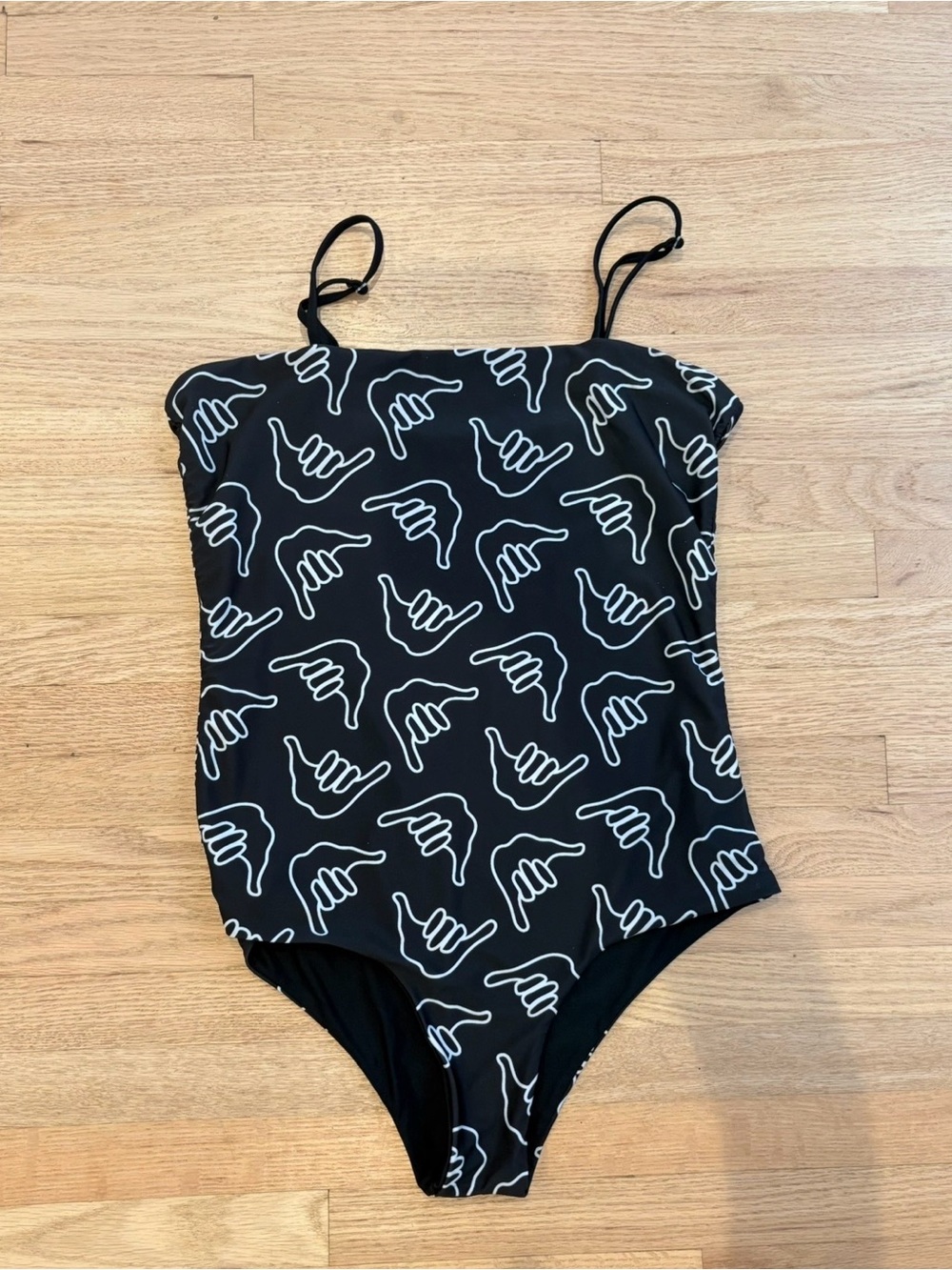 Of One Sea reversible Black One-Piece Swimsuit with White Shaka Print